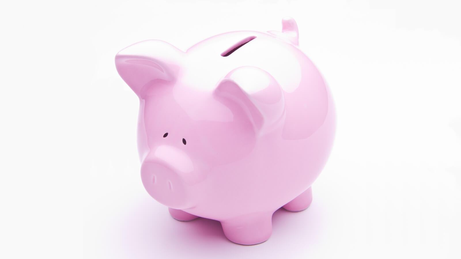 Cofrinho de porco rosado.