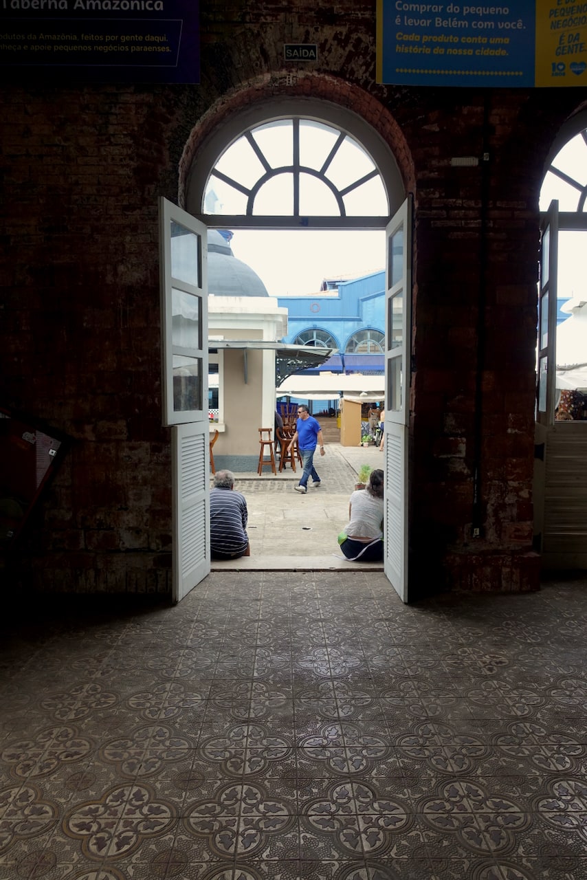 Two people sitting at the entrance of Solar da Beira.