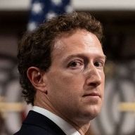 White man, looking sideways, with a worried face.